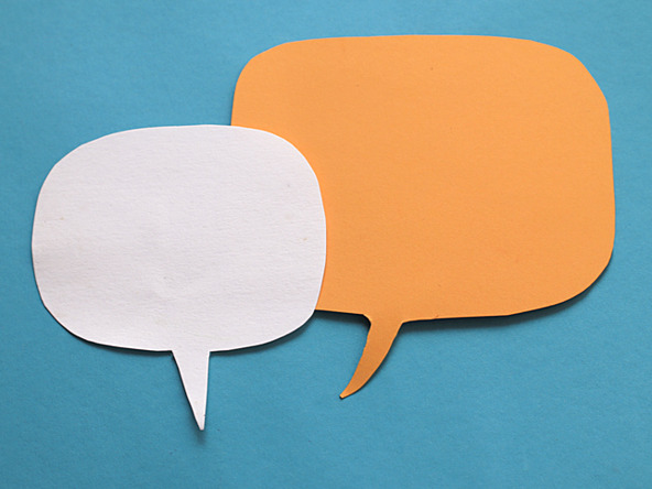 a white speech bubble and orange speech bubble